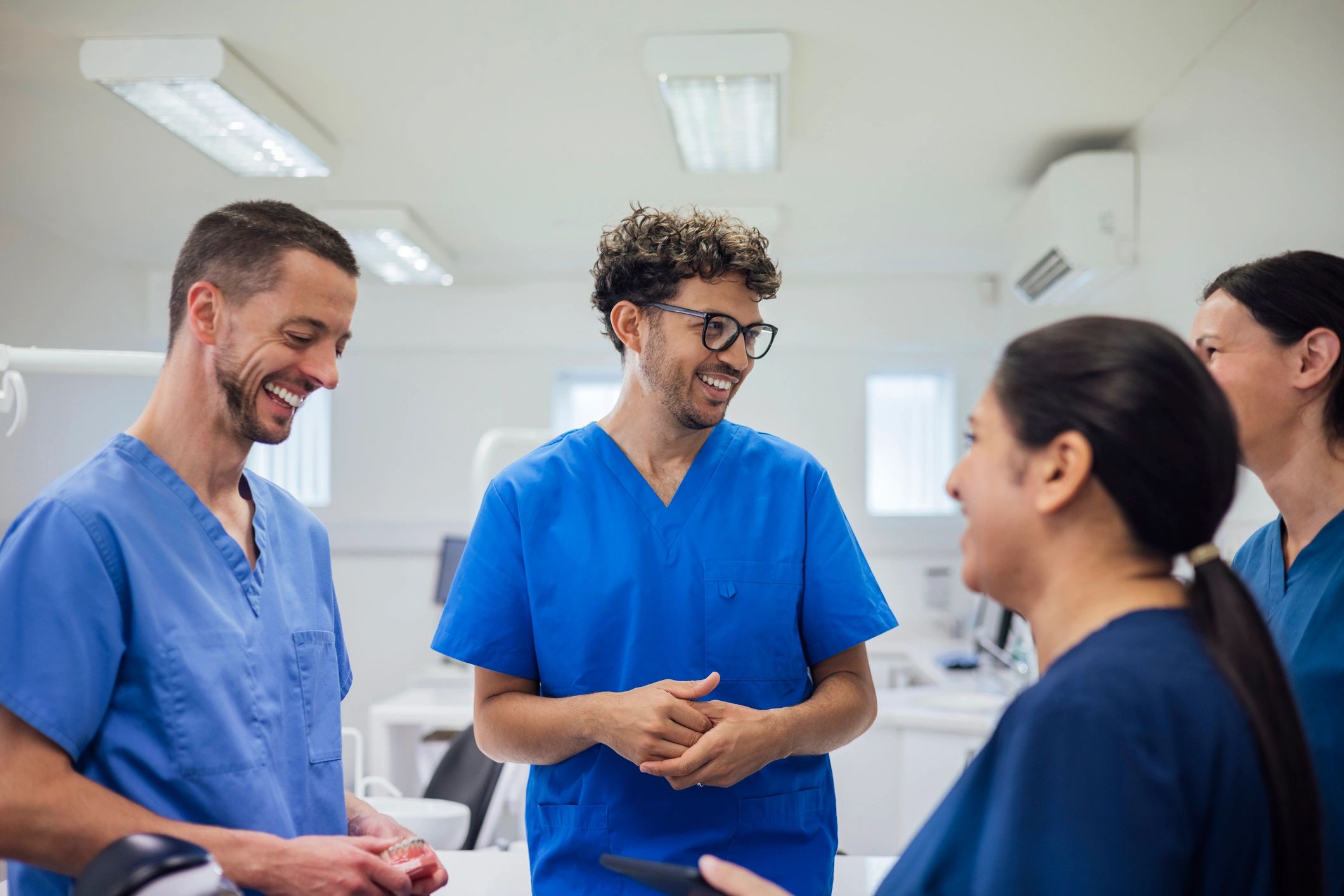 Healthcare professionals collaborating on business strategy in a practice setting