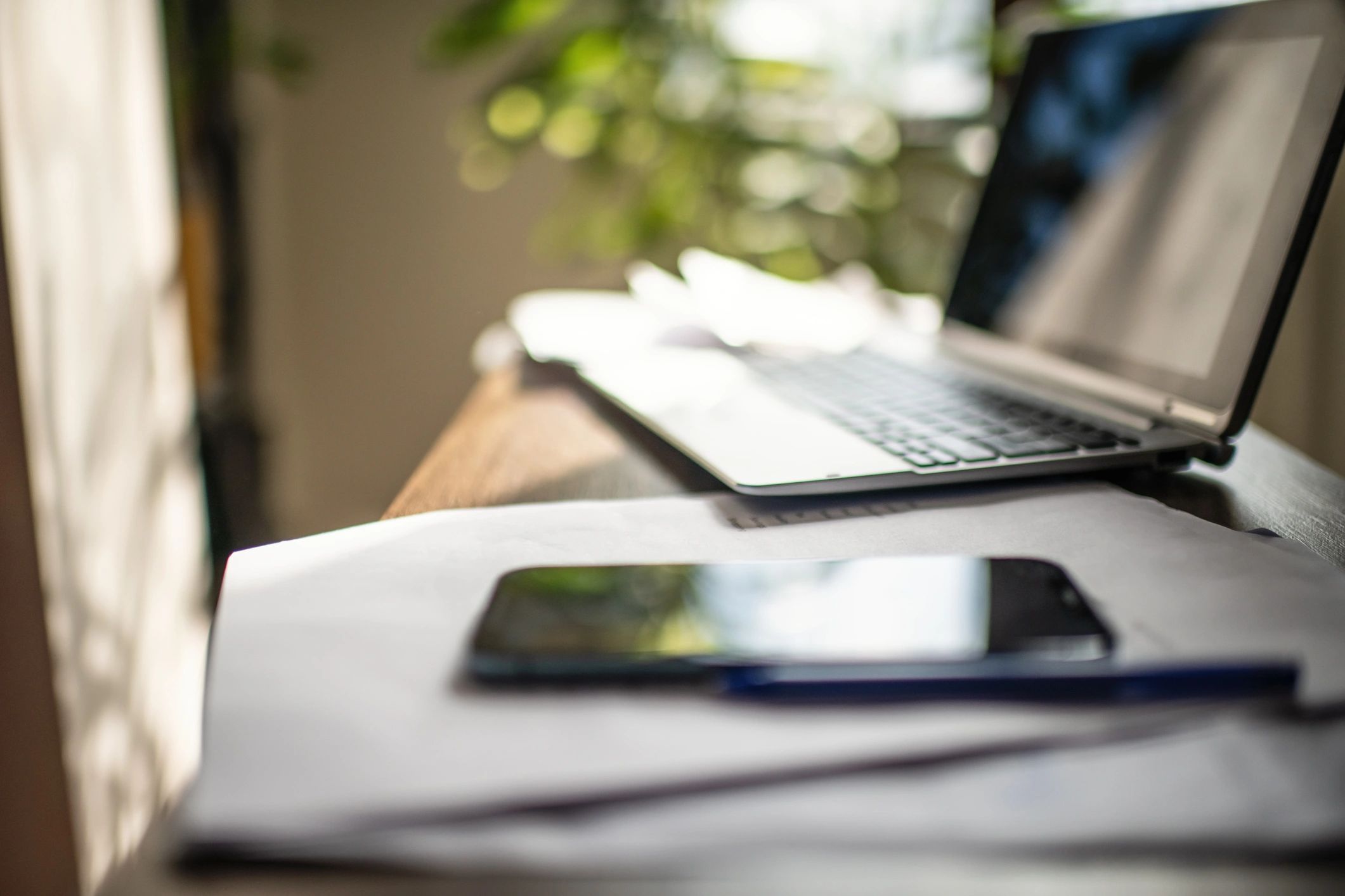 Business planning documents and laptop for templates and operational tools