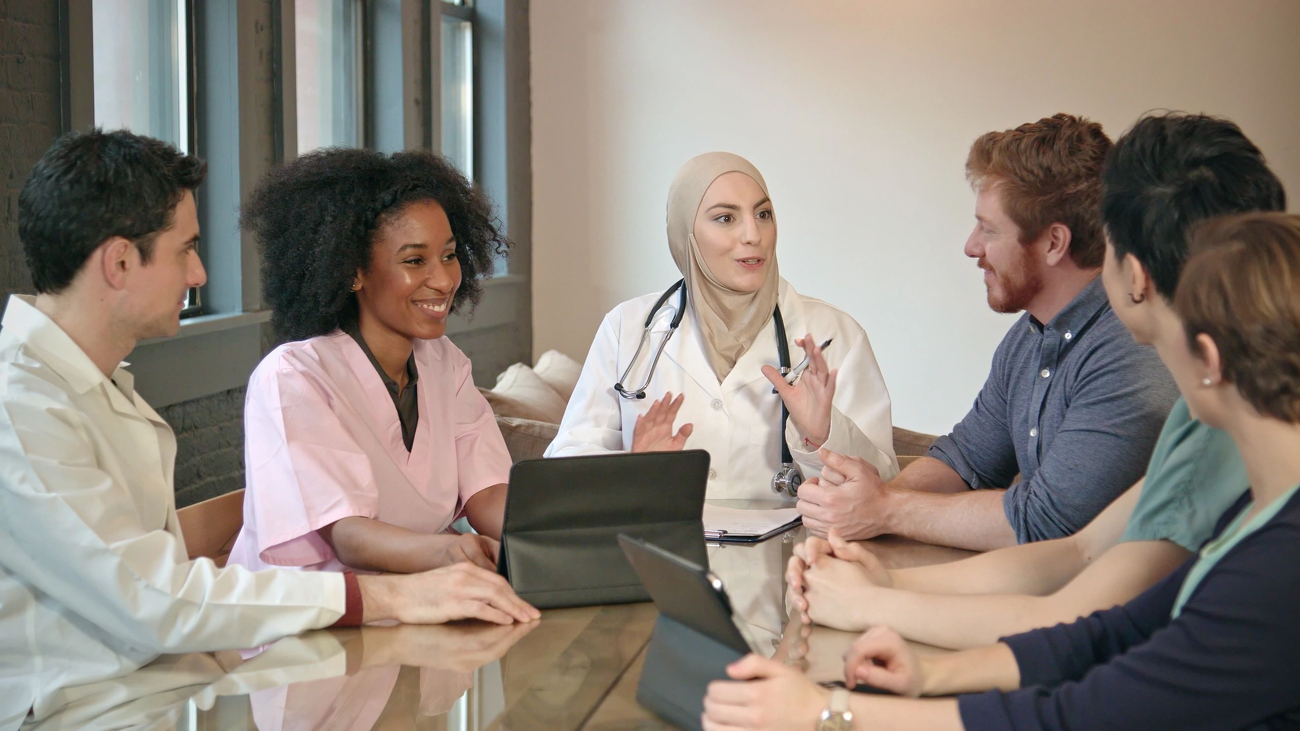 Doctor leading a strategy discussion with healthcare professionals